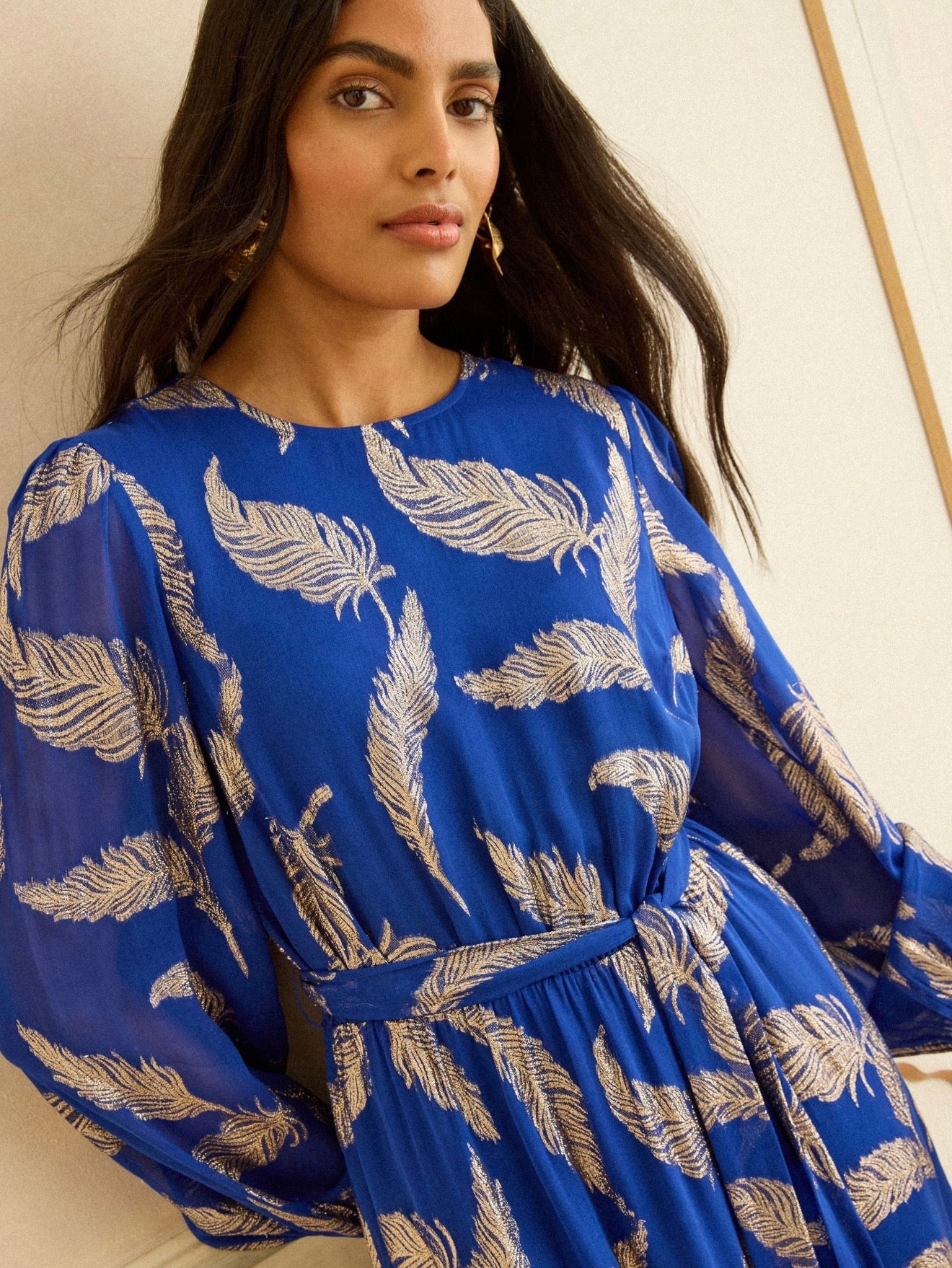 WLD dress with metallic gold feather